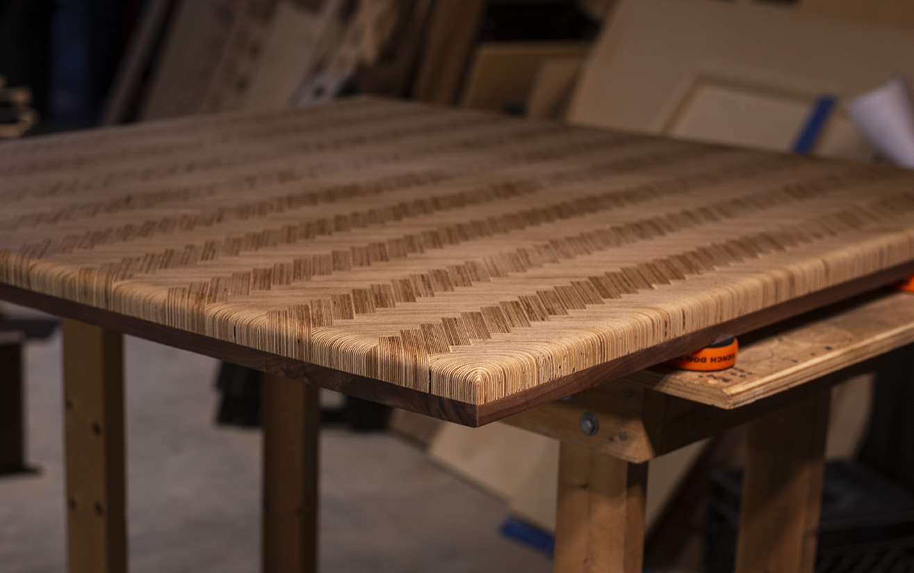 Custom laminated herringbone tabletop edge