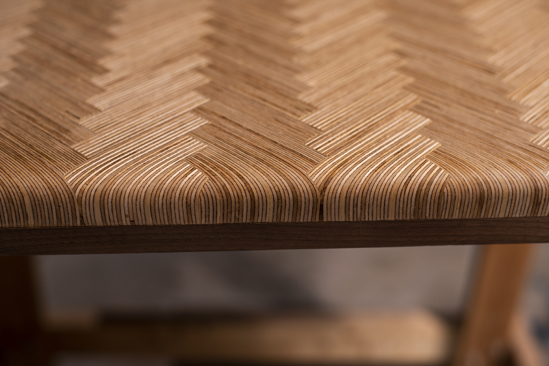 Custom laminated herringbone tabletop edge